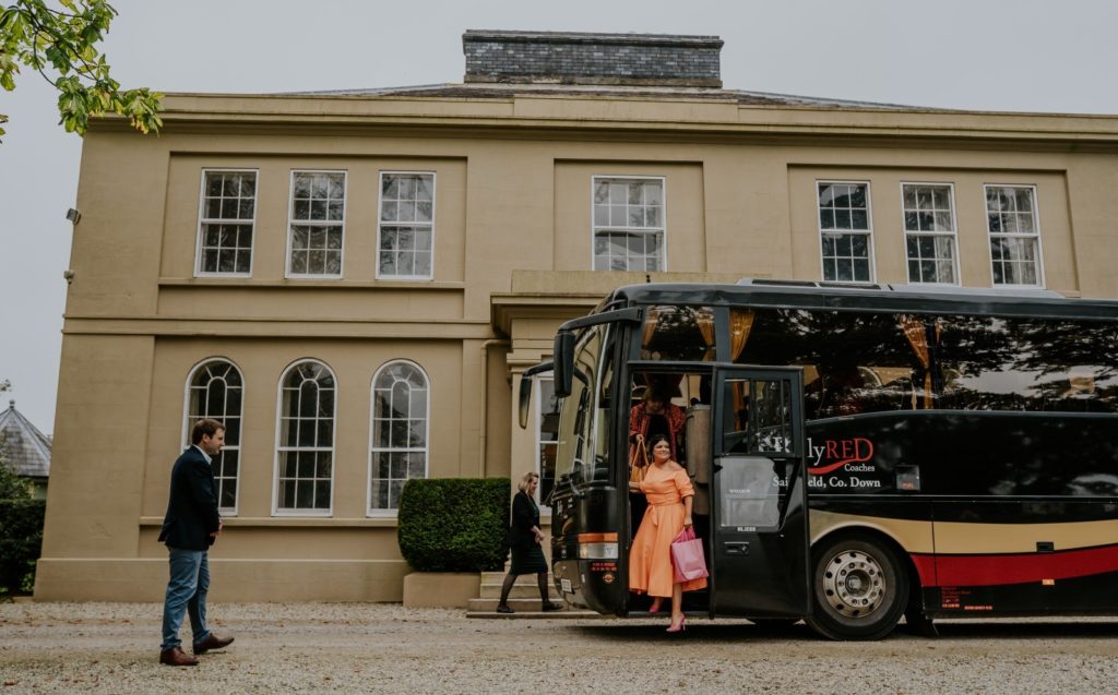 Bus arriving at front of house